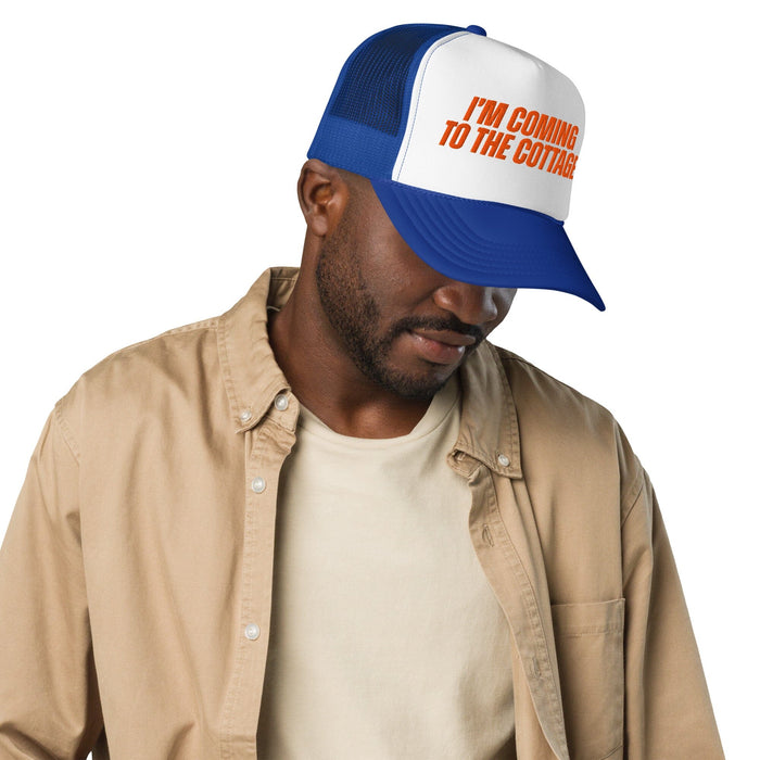 Man wearing a blue and white cap with 'EDISON' printed on it, against a white background