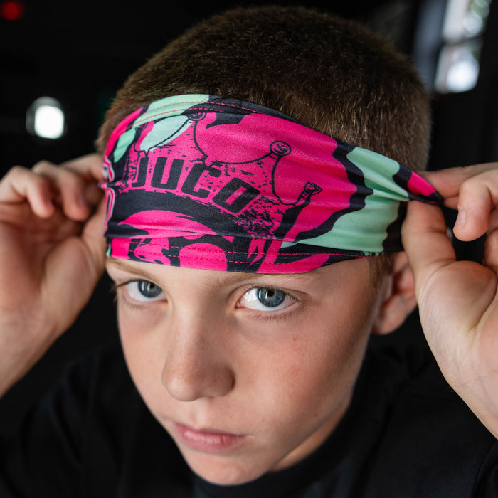 Youth model wearing black headband with "King of JUCO" design
