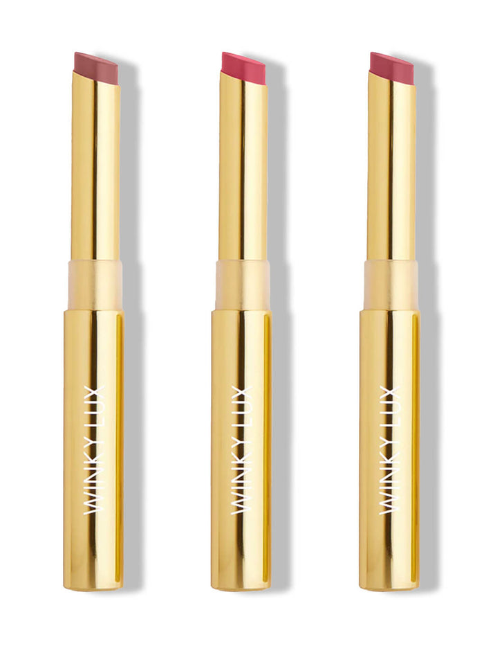 three nude shades of skinny plump demi matte lipstick on white background