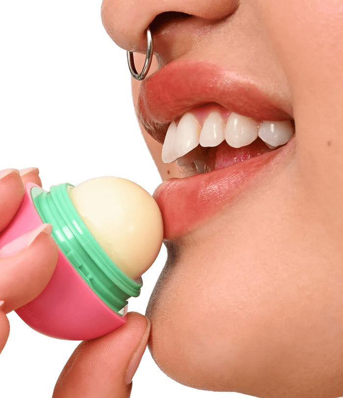 model applying lip balm sphere